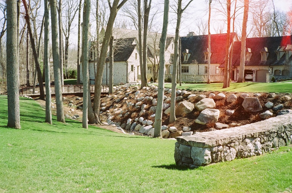 Trees and Houses with Rock Wall
