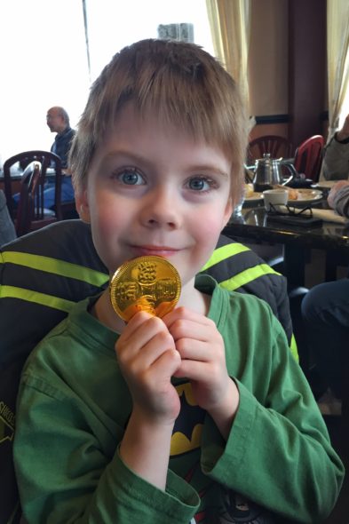 Connor with an oversized chocolate coin