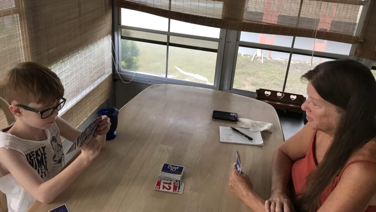 Photo: Connor and Grammy playing a card game in Florida